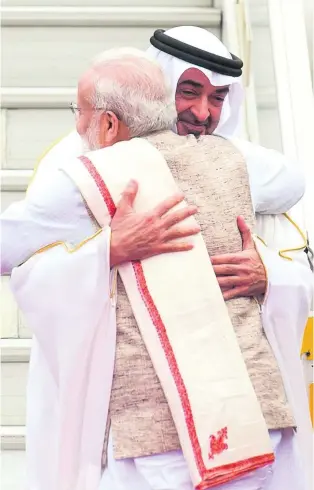  ?? Rashed Al Mansoori / Crown Prince Court Abu Dhabi ?? Sheikh Mohammed bin Zayed, Crown Prince of Abu Dhabi and Deputy Supreme Commander of the Armed Forces, is greeted by Indian prime minister Narendra Modi on his arrival in Delhi for a three-day visit, where he will be chief guest at Republic Day...
