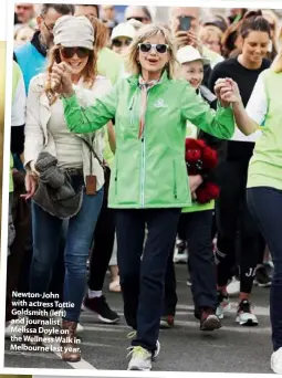  ??  ?? Newton-John with actress Tottie Goldsmith (left) and journalist Melissa Doyle on the Wellness Walk in Melbourne last year.