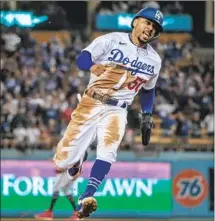  ?? Robert Gauthier Los Angeles Times ?? MOOKIE BETTS turns on the afterburne­rs to score from first base on an eighth-inning double by Corey Seager for a 3-2 lead.