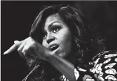  ?? JEWEL SAMAD/GETTY-AFP ?? In her book, former first lady Michelle Obama calls out President Donald Trump over “bigotry and xenophobia.”