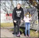  ?? CODY MCEACHERN/TRURO DAILY NEWS ?? Jonathan Torrens helps his daughter Sugar-Daisy prepare for her part in the Bike Monkey commercial, shot for the Hubtown Ad Challenge.