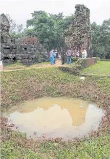  ??  ?? WAR WOUNDS: Left, bomb craters are still visible to visitors today throughout the complex.