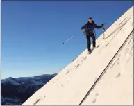  ?? Jason Torlano / Associated Press ?? In this photo provided by Jason Torlano, Zach Milligan is shown on his descent down Half Dome in Yosemite National Park, Calif.