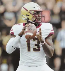  ?? AP PHOTO ?? UNLUCKY 13: Anthony Brown looks to pass last Saturday during Boston College’s 30-13 loss to Purdue. The Eagles return home Saturday to face Temple.