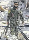  ?? AFP ?? A Syrian fighter after liberating an area in Raqqa from Islamic State.