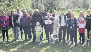  ??  ?? ●●Residents protesting against the plans to build 119 new homes at Spring Mill in Whitworth.