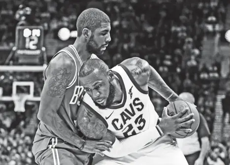  ?? (AP PHOTO/TONY DEJAK) ?? FORMER TEAMMATES. Cleveland Cavaliers' LeBron James, right, tries to get past Boston Celtics' Kyrie Irving in the second half of an NBA basketball game, Tuesday, Oct. 17, 2017, in Cleveland. The Cavaliers won 102-99.