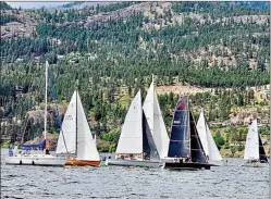  ?? ?? Contribute­d
The tall sails of Naitaka can be seen behind the other racing keelboats at Kelowna’s Blossom Time Regatta on the May long weekend. Named for the Ogopogo, Naitaka means lake demon in Salish.