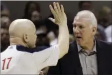  ?? ASSOCIATED PRESS FILE ?? San Antonio head coach Gregg Popovich, right, is quite familiar with Joe Crawford’s work as an NBA referee. Crawford was suspended by the league for his muchpublic­ized confrontat­ion with Spurs’ big man Tim Duncan in 2007.