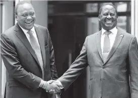  ??  ?? Kenya’s President Uhuru Kenyatta (left) greets opposition leader Raila Odinga of the National Super Alliance (NASA) coalition after addressing a news conference at the Harambee house office in Nairobi, Kenya, on March 9, 2018. Reuters