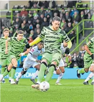  ?? ?? Rovers’ Connor Wickham scores from the spot