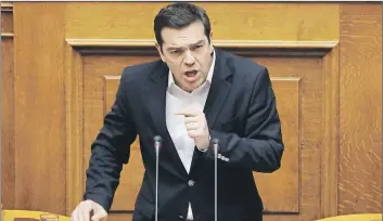  ??  ?? Greek Prime Minister Alexis Tsipras speaks Friday in parliament in Athens about the bailout negotiatio­ns.