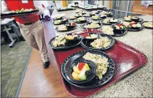  ??  ?? Class participan­ts got to eat the tuna noodle casserole they were taught how to prepare.