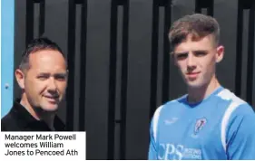  ??  ?? Manager Mark Powell welcomes William Jones to Pencoed Ath