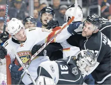  ?? Lynne Sladky Associated Press ?? ALEC MARTINEZ, right, of the Kings takes a shot from Florida’s Jonathan Huberdeau in second period.