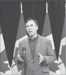  ?? CP PHOTO ?? Minister of Finance Bill Morneau speaks to the media before the Liberal cabinet retreat in London, Ont.