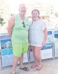  ??  ?? A car crushed under rubble on the Greek island of Kos following the earthquake, and (right) Pat Ramsey with his daughter Aine in Turkey