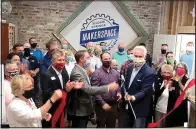  ?? (NWA Democrat-Gazette/Janelle Jessen) ?? Siloam Springs Chamber of Commerce celebrates the opening of its new maker space with a ribbon cutting Monday.