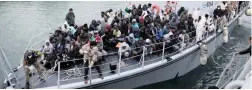  ?? PICTURE: REUTERS ?? Refugees on a boat arrive at a naval base after they were rescued by Libyan coast guards this week.