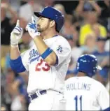  ??  ?? ADRIAN GONZALEZ enjoys the moment after his two-run home run in the sixth inning.