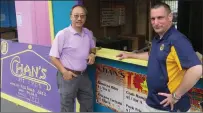  ?? Photo by Joseph B. Nadeau ?? Restaurant owner John Chan, left, and Autumnfest organizer Kevin Greenough meet up on Thursday to discuss set-up for the Autumnfest food court.