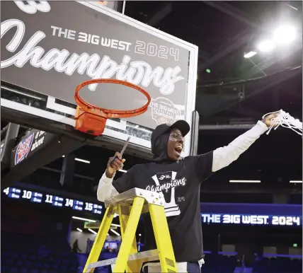  ?? RONDA CHURCHILL — THE ASSOCIATED PRESS ?? UC Irvine's Diaba Konaté is cheerful in a net-cutting ceremony after the Anteaters defeated UC Davis in the Big West Conference title game.