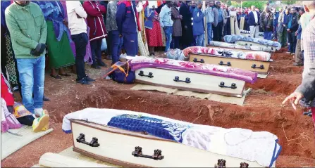  ?? ?? Some of the coffins of the 10 people who died in an accident at Siphambanw­eni. The funeral was at Timphandze­ni under Sigwe Constituen­cy in the Shiselweni Region. The coffins were placed next to each grave before they were lowered into the ground.