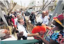  ?? Picture / AP ?? Emmanuel Macron promised residents of St Martin that France would rebuild the island as a “model” for withstandi­ng future storms.