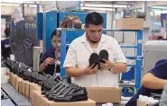  ?? MARIO ARMAS/ASSOCIATED PRESS ?? People work in a shoe maquilador­a or factor in Leon, Mexico Feb. 7. It has been nearly two years since the U.S. began pressing Mexico over labor rights violations.