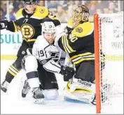  ?? Maddie Meyer Getty Images ?? THE KINGS’ Alex Iafallo, squeezed by the Boston Bruins, has never played in an NHL playoff game.