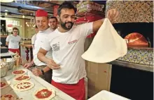 ??  ?? Pizza bakers prepare traditiona­l pizza margherita during a press tour at FICO Eataly World agri-food park.