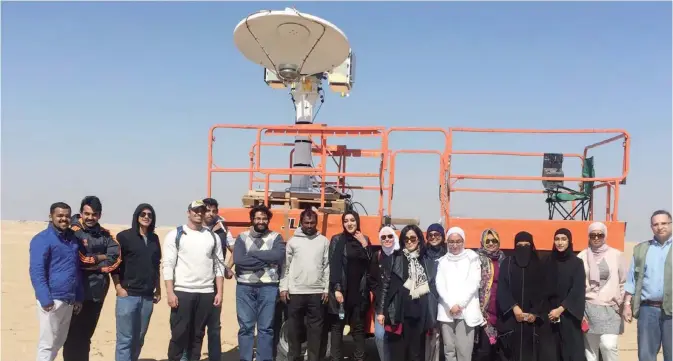  ??  ?? KUWAIT: Dr Hala Al-Jassar poses with a number of her students working in the field. — KUNA photos
