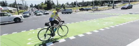  ??  ?? Drivers should be on the lookout for cyclists in vehicle lanes, even when there’s a bike lane available.