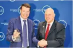  ??  ?? President and CEO of Greater New York Chamber of Commerce Mark Jaffe awards Vladimir Gerasichev with Corporate Culture Award.