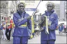  ?? ELISE AMENDOLA / ASSOCIATED PRESS ?? Kenyans Edna Kiplagat (left) and Geoffrey Kirui won in their Boston Marathon debuts. For Kirui, it was only his third marathon.