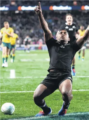  ??  ?? Man of the moment . . . All Blacks winger Sevu Reece celebrates his try as Wallabies centre James O’Connor looks on during the Bledisloe Cup test at Eden Park in Auckland on Saturday.