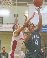  ?? JASON MALLOY/THE GUARDIAN ?? UPEI Panthers guard Samy Mohamed, right, takes a shot while being defended by Davion Parnsalu Sunday during Atlantic University Sport men’s basketball in Charlottet­own.