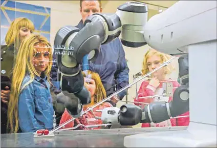  ??  ?? New technologi­es: Children at an exposition about robotics and artificial intelligen­ce. Companies that don’t keep pace with change will have problems hiring millennial­s.Photo: Philippe Clèment