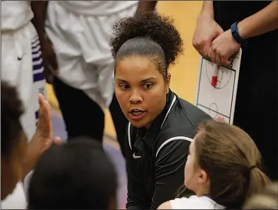  ?? Terrance Armstard/News-Times ?? In charge: El Dorado girls basketball coach Destinee Rogers talks to her team during a timeout last season against Texarkana. Rogers, who led the Lady Wildcats to the 6A state semifinals in her debut season, recently rounded out her coaching staff. El...