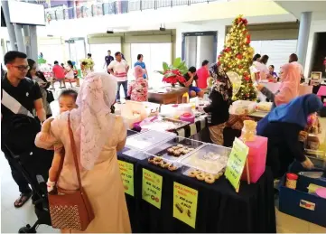  ??  ?? Some of the stalls at Naim’s Christmas Charity Bazaar.