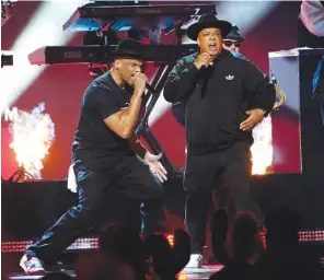  ?? AP PHOTO/CHRIS PIZZELLO ?? Run-DMC performs “King of Rock” at the 65th annual Grammy Awards on Sunday in Los Angeles.