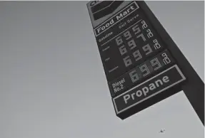  ?? MARCIO JOSE SANCHEZ/AP ?? Gas prices are advertised at nearly $7 a gallon Monday in Los Angeles. President Joe Biden says Americans could be paying more at the pump with the new sanctions on Russia.