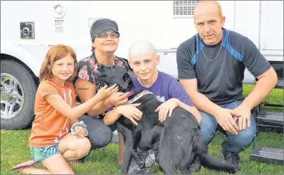  ?? &3*$ .$$"35): +063/"- 1*0/&&3 ?? Members of the Sweet family, Messina left, Tracy, Jamison, Cory and their dog, Jersey, pose in front of the camper 12-year-old Jamison received as a Children’s Wish Foundation wish. He’s fighting a rare form of cancer that attacks soft tissue.
