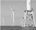  ?? MICHAEL DWYER/AP 2016 ?? Deepwater Wind’s turbines stand in the water off Block Island, Rhode Island.