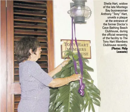  ?? (Photos: Philp Lemonte) ?? Sheila Hart, widow of the late Montego Bay businessma­n Anthony “Tony” Hart, unveils a plaque at the entrance of the former Doctor’s Cave Bathing Beach Clubhouse, during the official renaming of the facility to The Tony Hart Members Clubhouse recently.