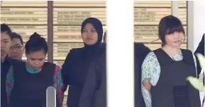  ?? Photo: Reuters ?? Vietnamese Doan Thi Huong and Indonesian Siti Aisyah who are on trial for the killing of Kim Jong Nam, are escorted as they leave the Shah Alam High Court on the outskirts of Kuala Lumpur, on October 3, 2017.