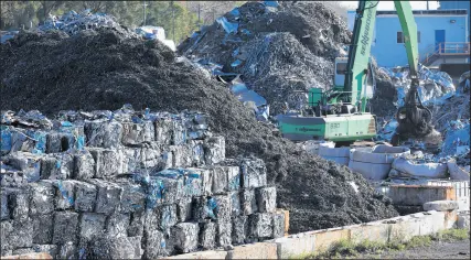  ?? JOHN J. KIM/CHICAGO TRIBUNE ?? Scrap metal is sorted along the Calumet River last month. Chicago and the Army Corps of Engineers reportedly were eyeing industrial sites on the Southeast Side to dispose of dredged sediment.