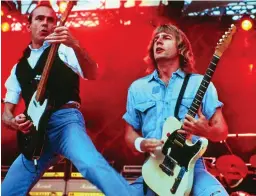  ??  ?? Rocking: Francis Rossi and Rick Parfitt in typical pose