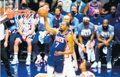  ?? AP ?? Brooklyn Nets’ Kevin Durant (7) drives past Atlanta Hawks’ John Collins (20) during the first half of a NBA basketball game on Wednesday night in New York.