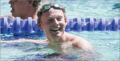  ?? SHAE HAMMOND — STAFF PHOTOGRAPH­ER ?? Palo Alto's Ethan Harrington, shown here smiling after breaking a meet record during the Central Coast Section swimming championsh­ips, broke the CIF state meet record on May 14in the 50-yard freestyle in Clovis.
